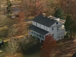 MS AERIAL TU Shot of wood burn plantation house at 130 history lane surrounded by trees / South Carolina, United States Stock Footage