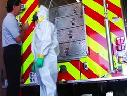 Fire fighters try on new 'Ebola suits' Stock Footage
