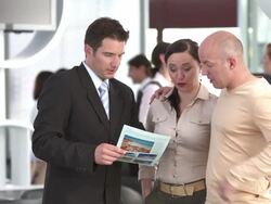 HD DOLLY: Travel Agent Handshaking With The Customers Stock Footage