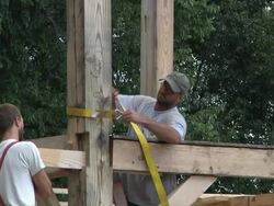 WS ZO Carpenters at working while framing an energy efficient post / Grass Lake, Michigan, USA         Stock Footage