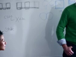 MS TU Businessman walking into workstation holding digital tablet leading discussion with coworkers at whiteboard/Washington, USA Stock Footage