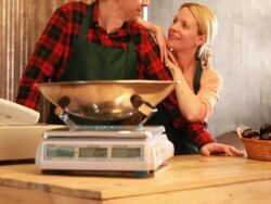 Portrait of male and female shop owners in grocery store Stock Footage