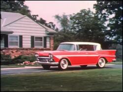 Montage:  1950s family greets Dad and his new car Stock Footage