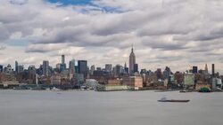 Manhattan, view of the Empire State Building and Midtown Manhattan across the Hudson River, New York, United States of America - Time lapse Stock Footage