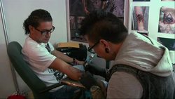 Fans of extreme body art showed off their modifications Thursday at the annual Venezuelan Tattoo Convention in Caracas. (Jan. 30) News Clip