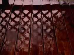 Rain on deck with reflection Stock Footage