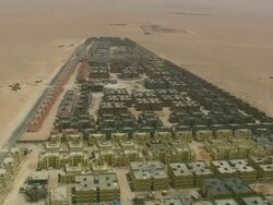 MS AERIAL Shot of buildings construction site at open land in city / Qatar Stock Footage
