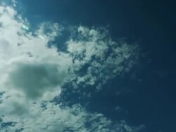 Cloud time lapse with deep blue sky and dark clouds appear. Stock Footage
