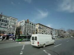 MS Shot of Traffic moving in front of shop and building on street / Istanbul, Turkey Stock Footage