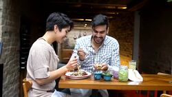 Couple eating at a Mexican restaurant Stock Footage
