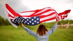 Walking with American flag Stock Footage