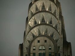 Extreme CU of the tower of the Chrystler building.  Sun gradually shimes on the face of the tower. Stock Footage