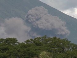 Pyroclastic flow ash explosion from volcanic eruption explodes near city, Philippines, Dec 2009 Stock Footage