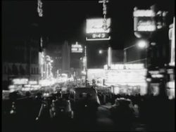 Traffic drives through Times Square in New York City at night. News Clip