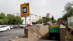 Entry to the Rajiv Chowk metro station at Janpath, near a busy street, in Connaught Place, New Delhi Stock Footage