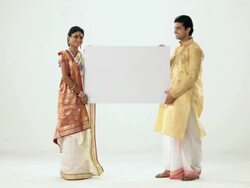 Portrait of a bengali couple showing a placard  Stock Footage