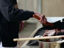 MS Senior man cooking ribs on his outdoor grill / Santa Fe, New Mexico, United States Stock Footage