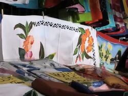 Draperies and pareos at a windy Polynesian street market Stock Footage
