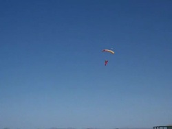 A skydiver swoops in for a nice landing . Stock Footage