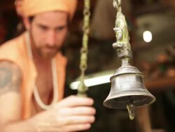 Sage ringing bells at market, Rishikesh, Uttarakhand, India Stock Footage