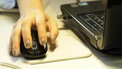 Woman working at home with laptop mouse Stock Footage