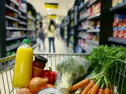 Point of view shot of children putting items in shopping trolley Stock Footage