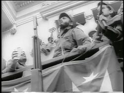 B/W 1959 low angle Fidel Castro enthusiastically giving speech from balcony / post-revolution Havana Stock Footage