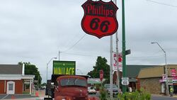Chandler Oklahoma old historical Route 66 old Phillips 66 gas station and 50s rusted truck kicks on Route 66 Stock Footage