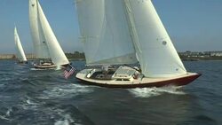 Three red hulled Morris M Series sailboats sail in tandem near Newport, Rhode Island. Stock Footage