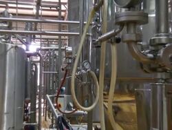 CU ZO Shot of boiling tanks in brewery / Wau, Western Bahr el Ghazal, Sudan  Stock Footage