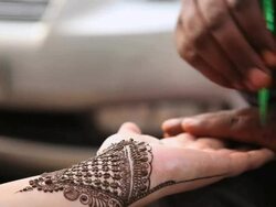 CU R/F Henna tattoo maker making tattoo on woman hand at lajpat nagar / Delhi, India   Stock Footage