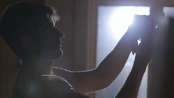 Shop worker ties price tag around skateboard wheel Stock Footage