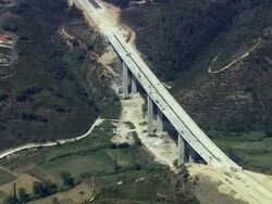 AERIAL WS ZI PAN Motorway bridge under construction / Cascais, Lisbon, Portugal Stock Footage