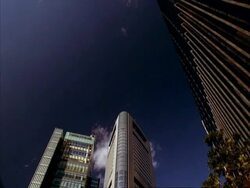 WA view looking up at Shiodome buildings late afternoon, Tokyo, Japan Stock Footage