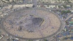 Aerials and groundshots of pilgrims at Mount Arafat in Mecca News Clip