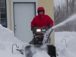 Man pushing snow blower Stock Footage