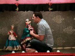 Mid adult man performing with puppets in a puppet show, Delhi, India Stock Footage