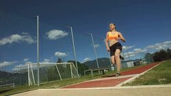 HD Super Slow-Mo: Young Woman In A Long Jump Stock Footage