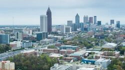 Elevated view over Interstate 85 passing the Downtown Atlanta skyline, Georgia, United States of America Stock Footage