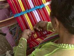 CU HA Shot of Over shoulder for woman weaving beautiful garment / Soe, Mt. Mutis, West Timor Indonesia Stock Footage