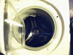 Woman opens old fashioned washer Stock Footage