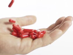 HD SUPER SLOW-MO: Capsules Falling Into A Hand Stock Footage