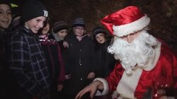 Santa drops into cave with festive treats for school children News Clip