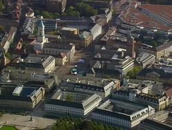 MS AERIAL Shot of buildings row beside garden of Schloss Karlsruhe / Germany Stock Footage