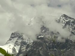Pull back snow capped cloudy himalyas uttarakhand Stock Footage