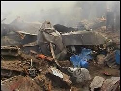 A cargo plane crashed in a residential neighborhood near the main airport in Congo's capital on Thursday, plowing into homes and killing at least 19 people, officials said. News Clip