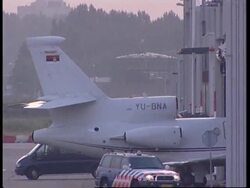 WRAP Karadzic arrives at airport, helicopters arrive at prison, ICTY spox News Clip