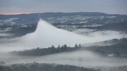 Looking down into the Langdale Valley above valley mist formed by a temperature inversion on Loughrigg, near Ambleside in the Lake District National Park. Stock Footage
