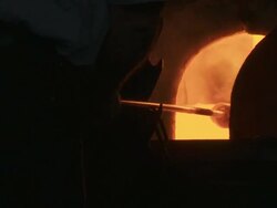 Glass Maker Gathering Molten Glass CU Stock Footage