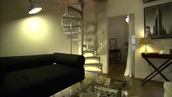 A spiral staircase highlights a fancy room in a hotel. Stock Footage